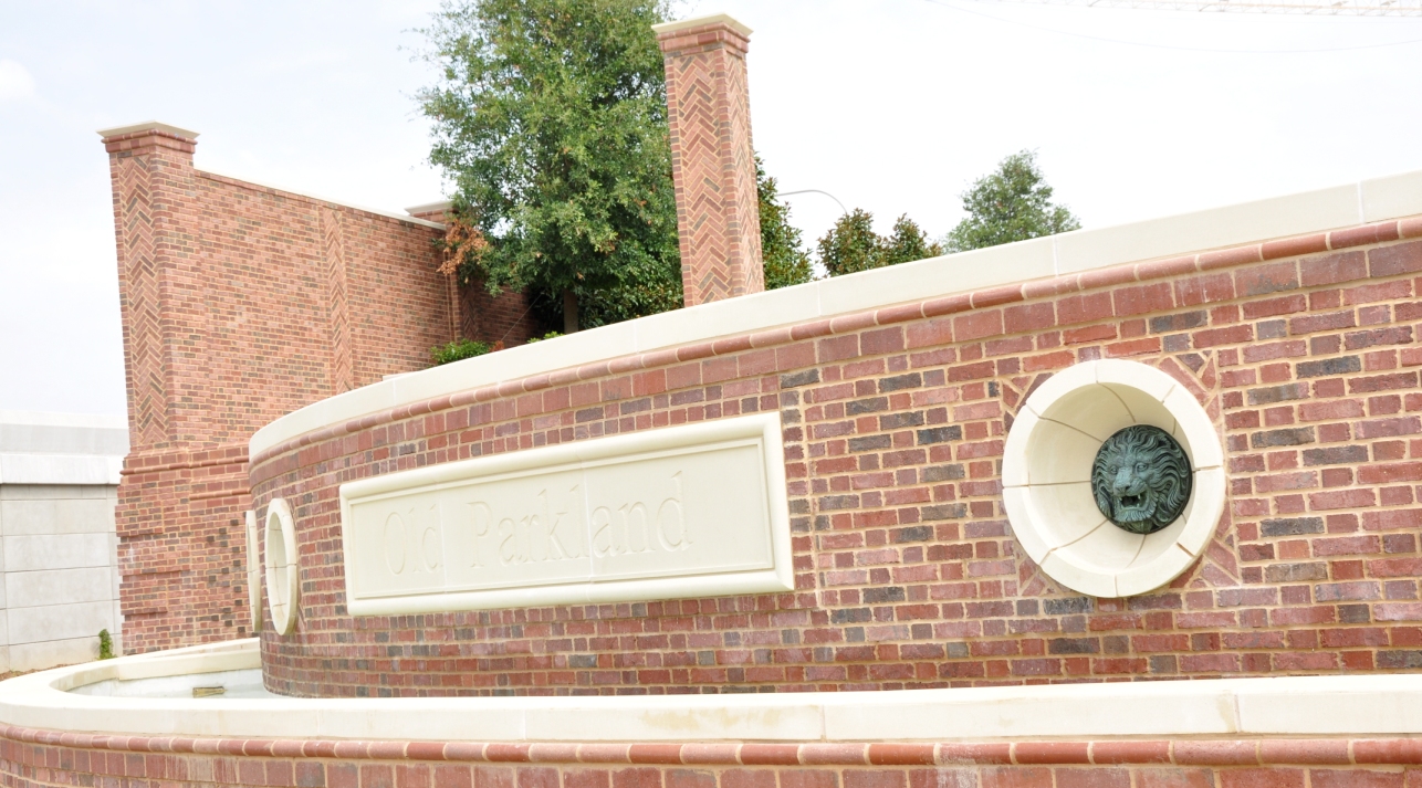 Old Park Land Exterior Hardscape | Wall Coping, Signage, Column Capitals | Designed Contrast with Brick Work